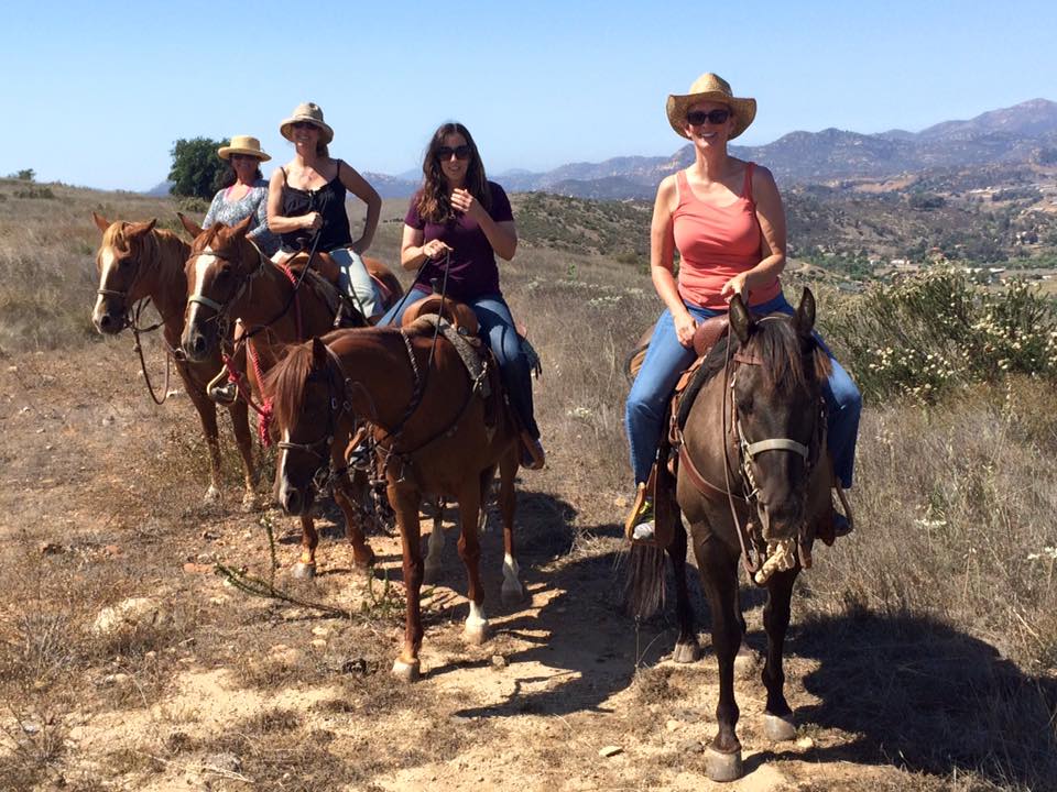 Four women on a horses in San Diego